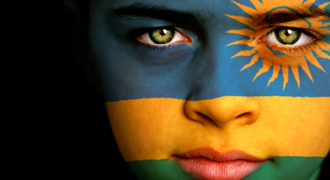 Image of Rwandan flag painted on a young boy's face